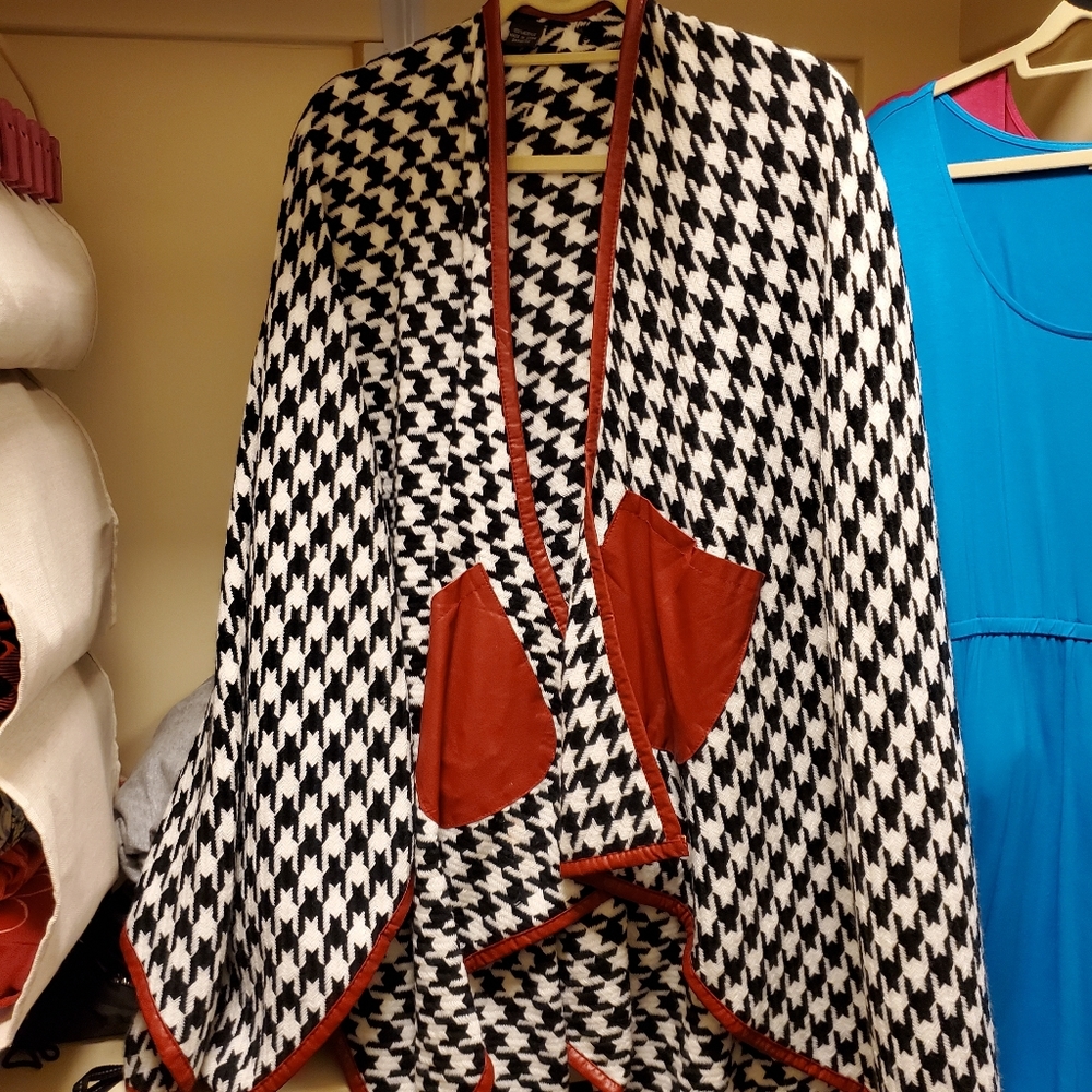 Houndstooth cape with red leatherette trim and poc